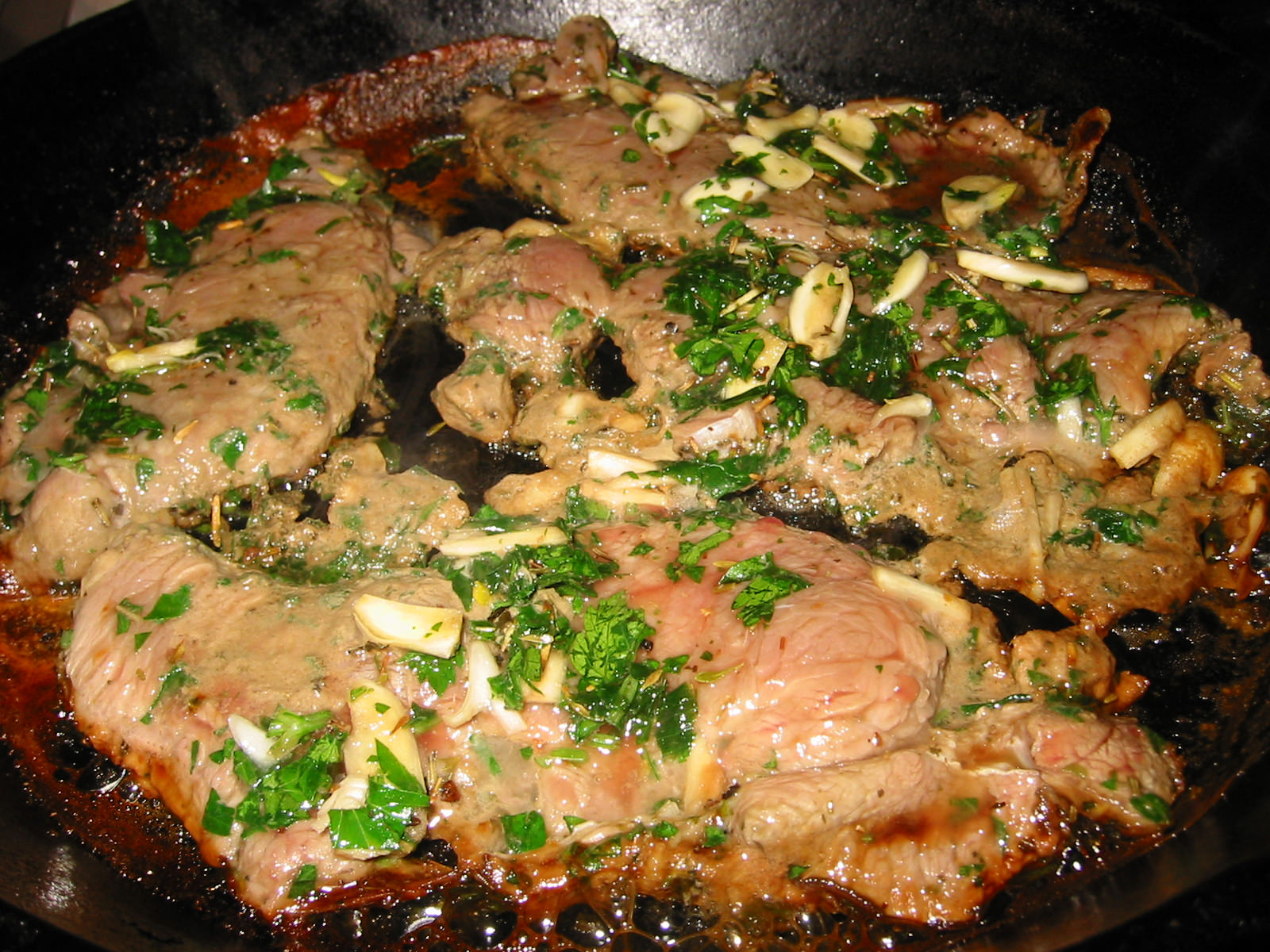 Pan frying marinated veal steaks