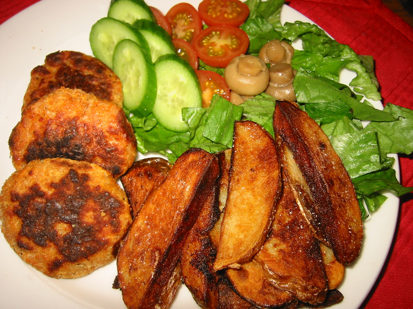 Chicken patties, well-done potato wedges