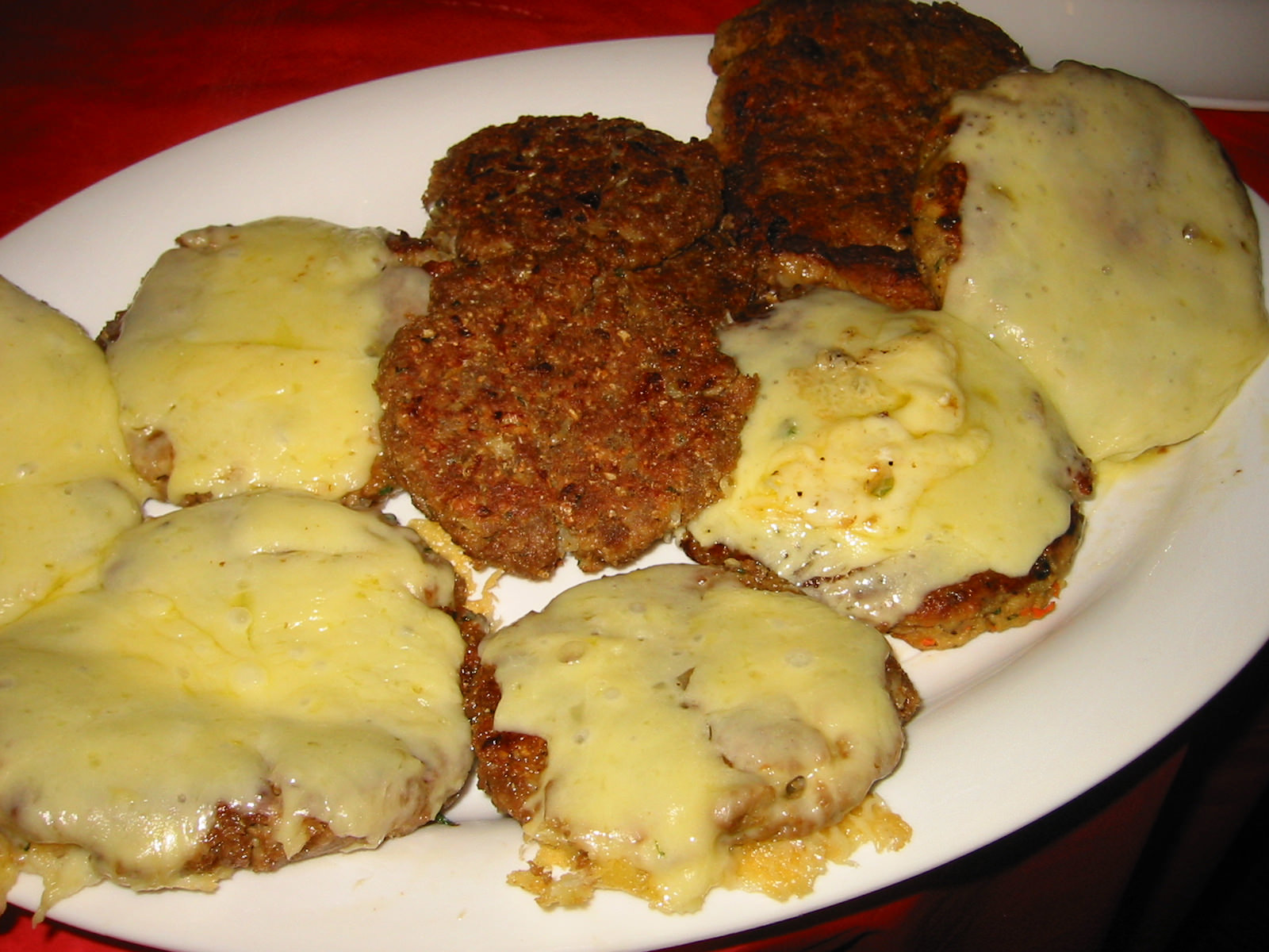 Burger patties, some with cheese, some vegetarian
