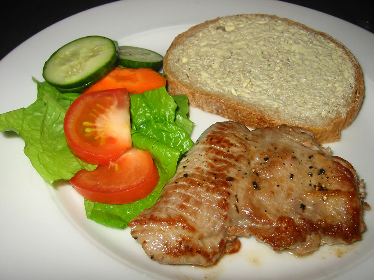 Turkey steak, salad and buttered bread