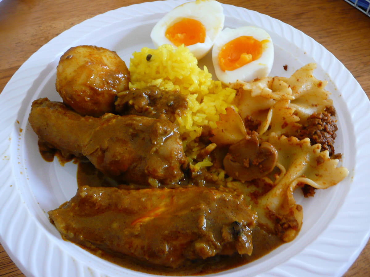 My plate - nasi kunyit and curry chicken with red egg peeled