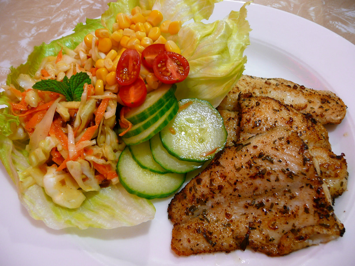 Panfried basa fillets with coleslaw and salad