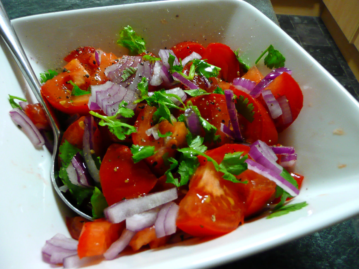 Tomato, red onion and coriander salad