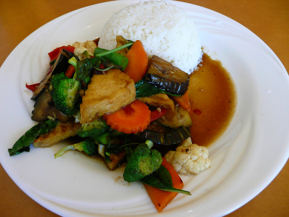 Vegetable and tofu wok stir fry with egg plant, chilli, garlic, basil and black bean