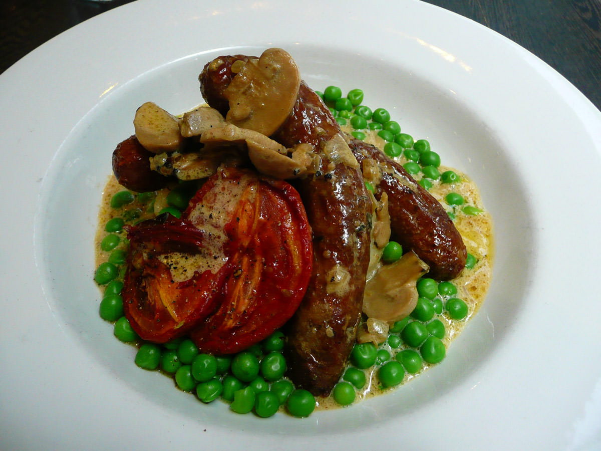 Pork sausages with mash and green peas