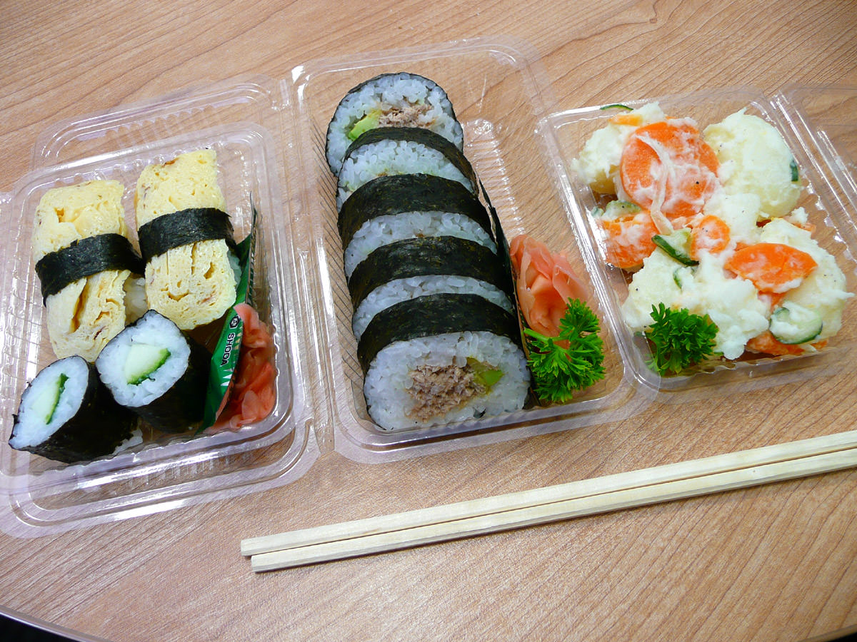 Tamago sushi, mini cucumber sushi, cooked tuna sushi and potato salad