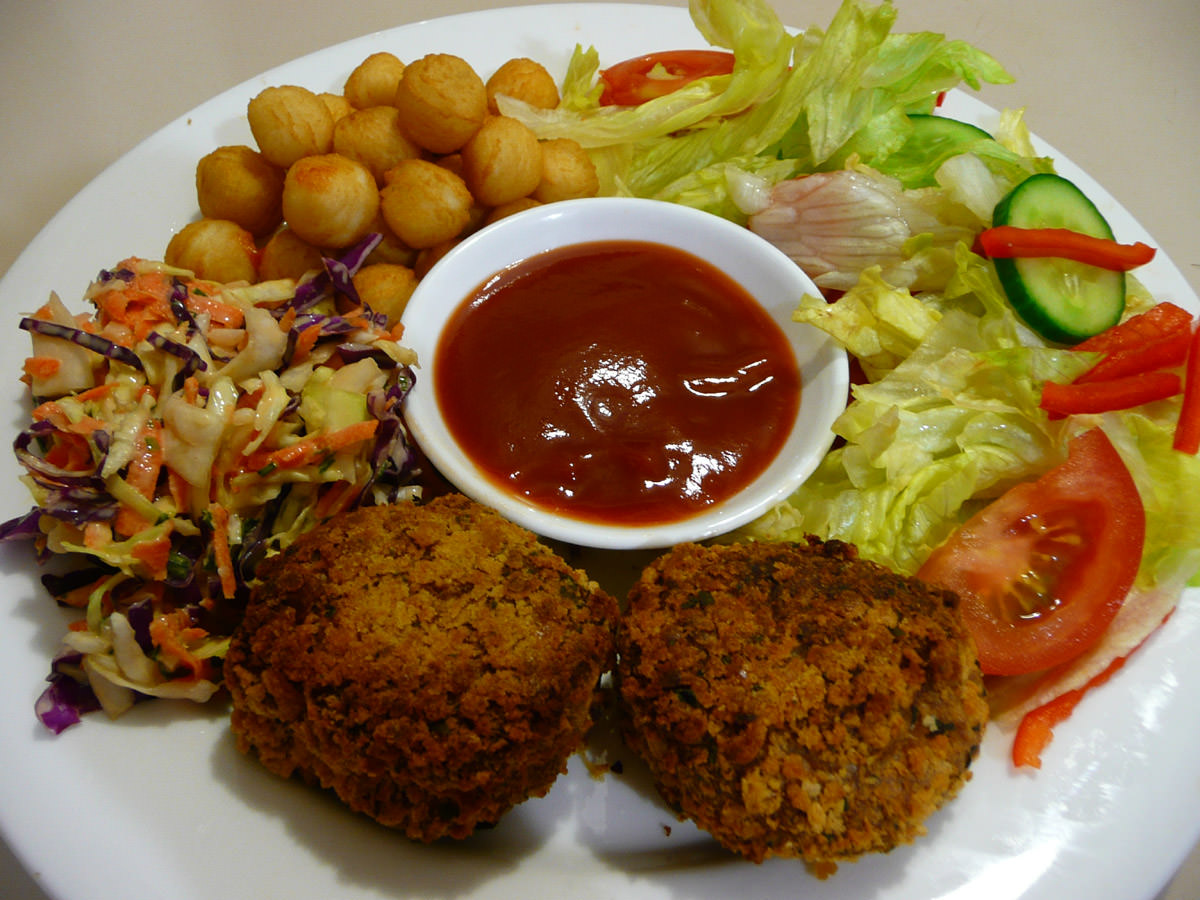 Chicken patties, coleslaw, salad and pommes noisettes