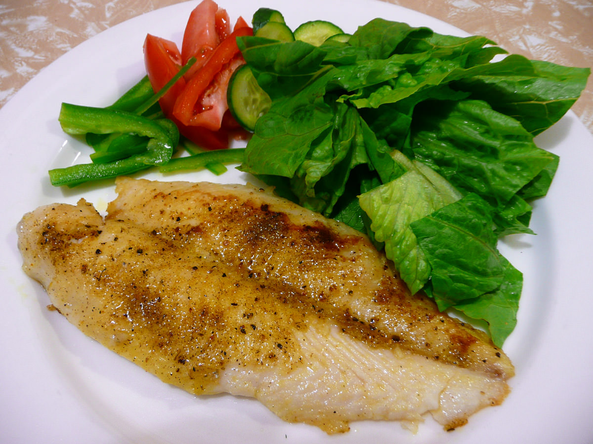 Lemon pepper-rubbed fish with salad
