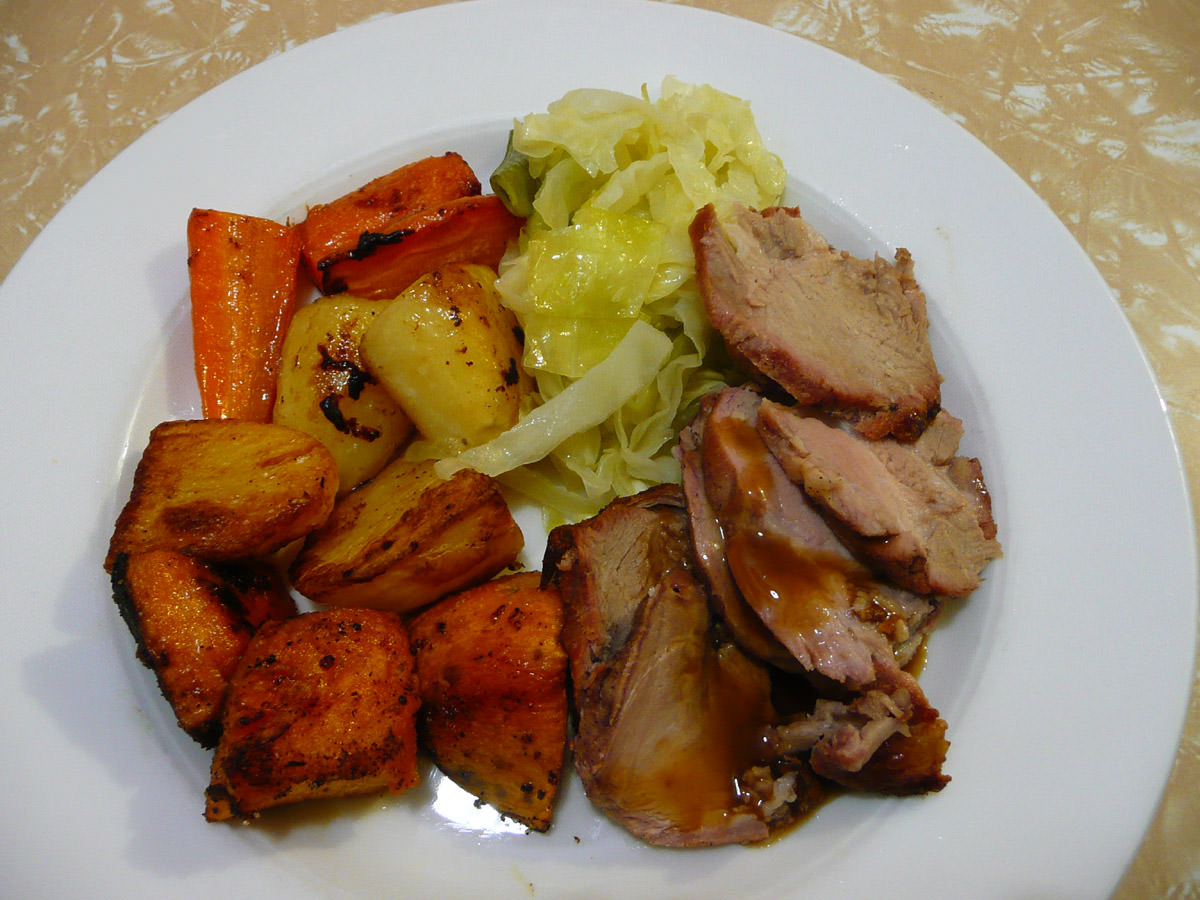 Roast pork, vegetables and buttered cabbage