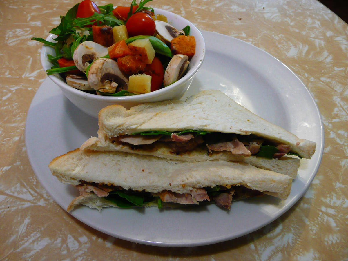 Roast pork and spinach sandwich, with rocket, spinach and roasted root vegetable salad