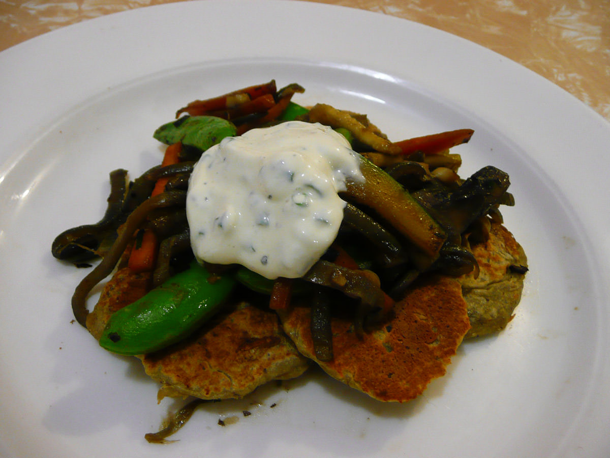 Eggplant blinis with chive sour cream and stir-fried vegetables