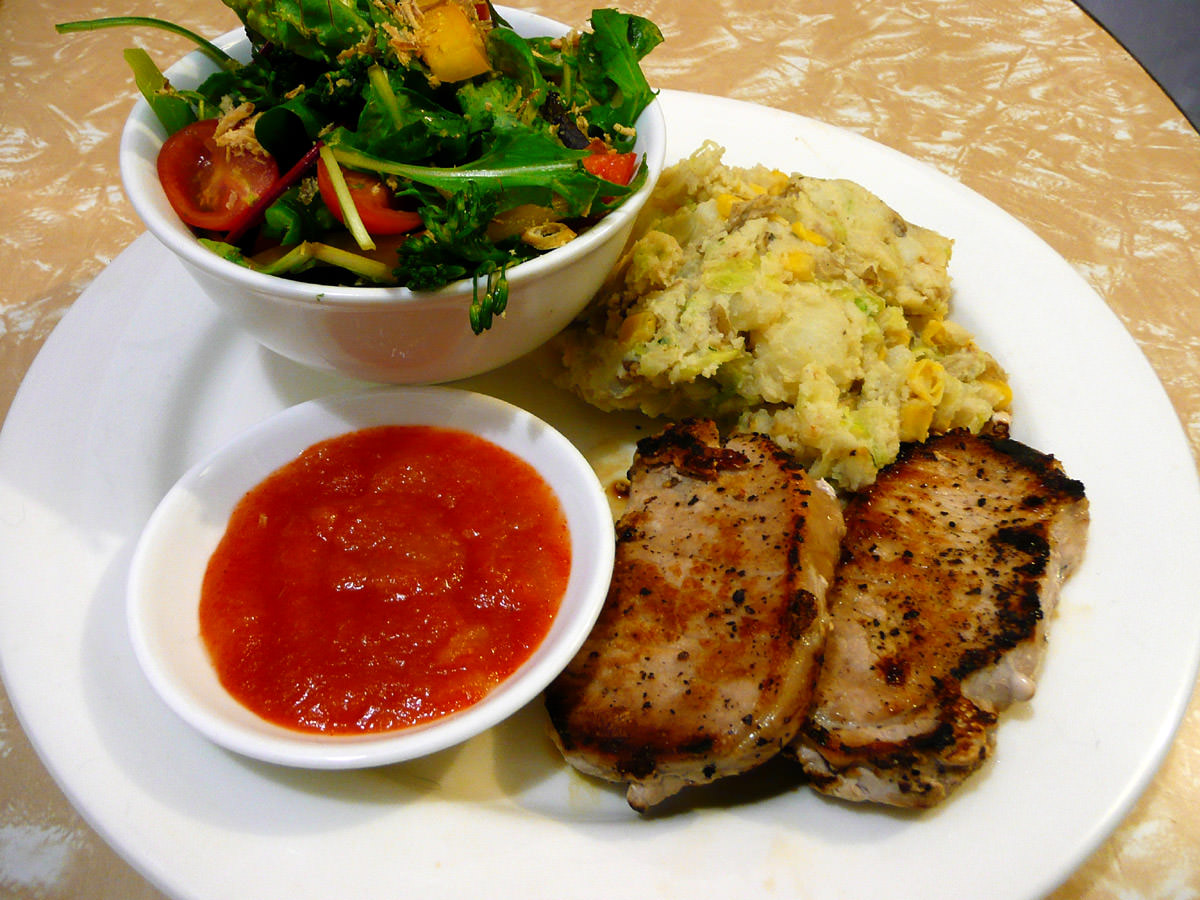 Pork steaks, bubble and squeak, salad and chilli sauce