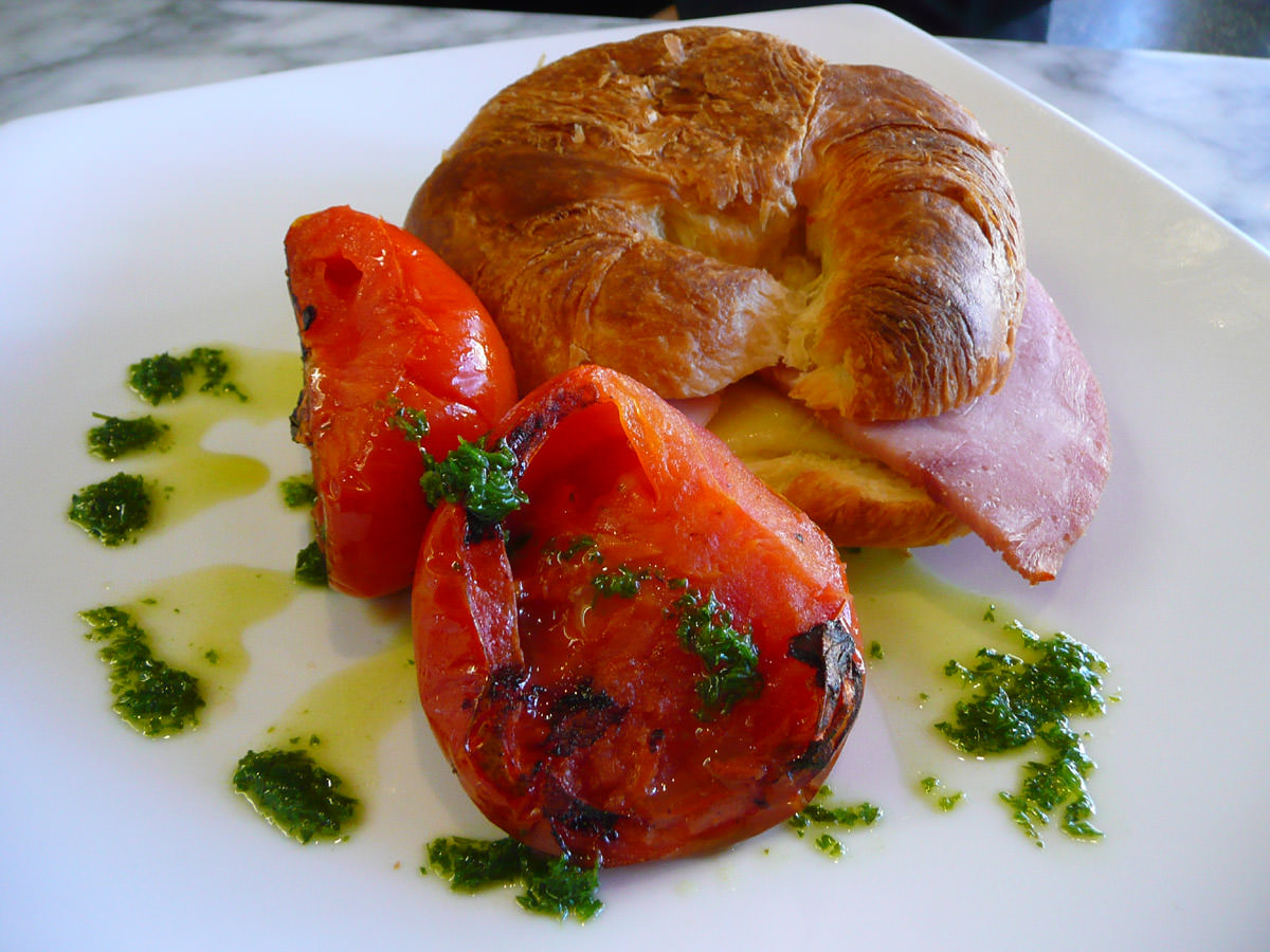 Ham and cheese croissant with tomato