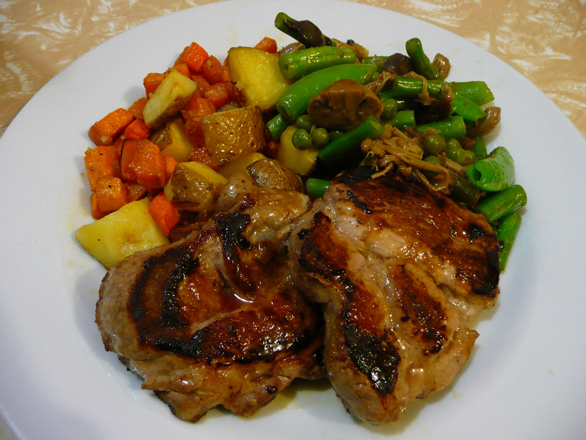 Pork steaks, mushrooms and peas, roasted potatoes, carrots and sweet potatoes