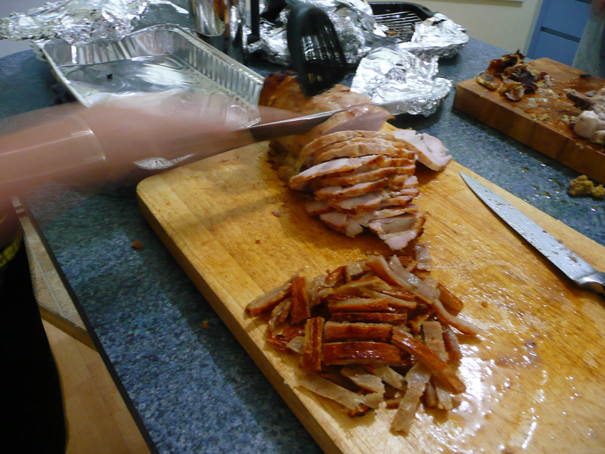 Slicing up the turkey breast roast (pork cracking in the foreground)