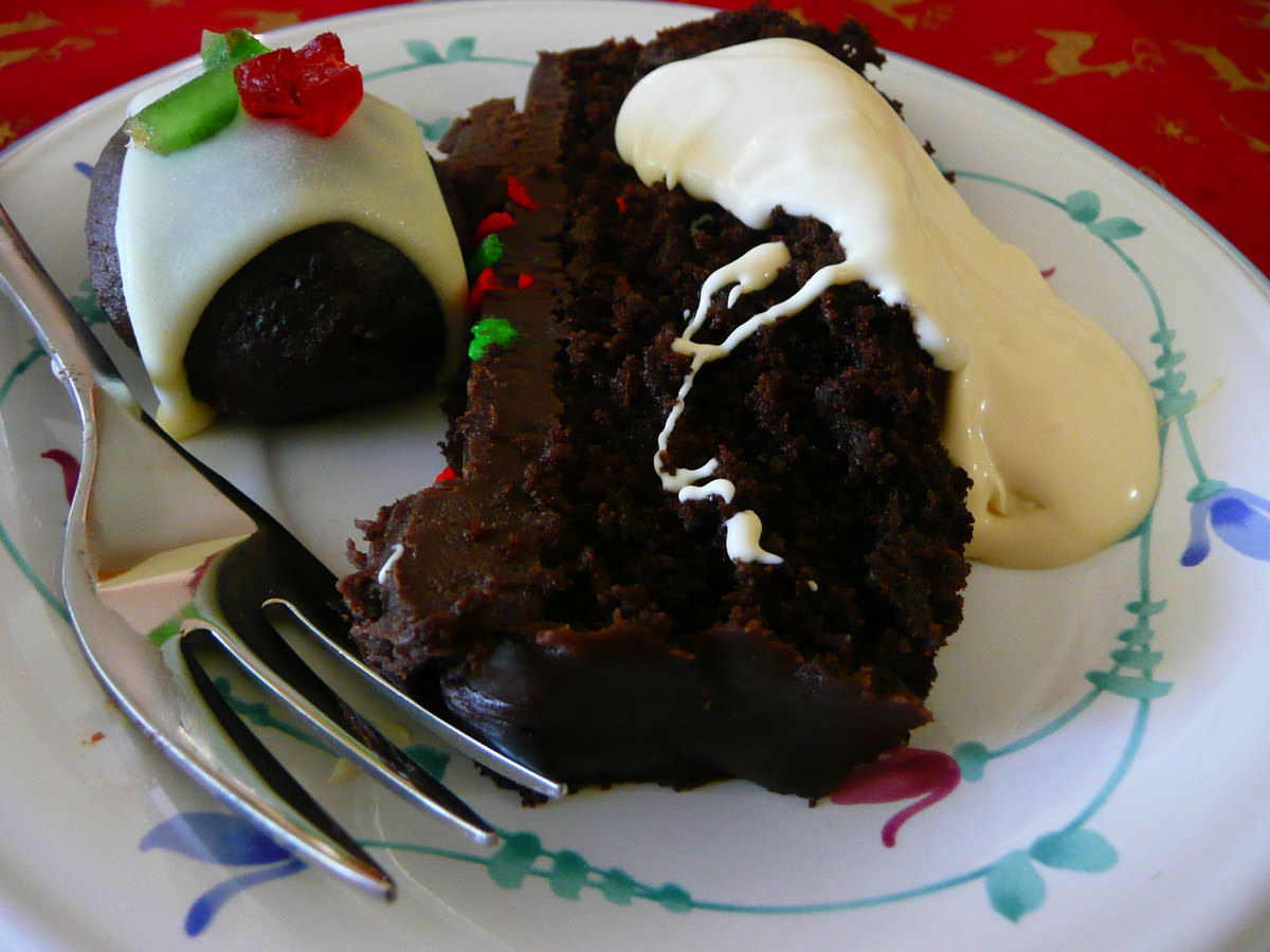 Christmas chocolate cake, brandy cream and a mini Christmas pudding