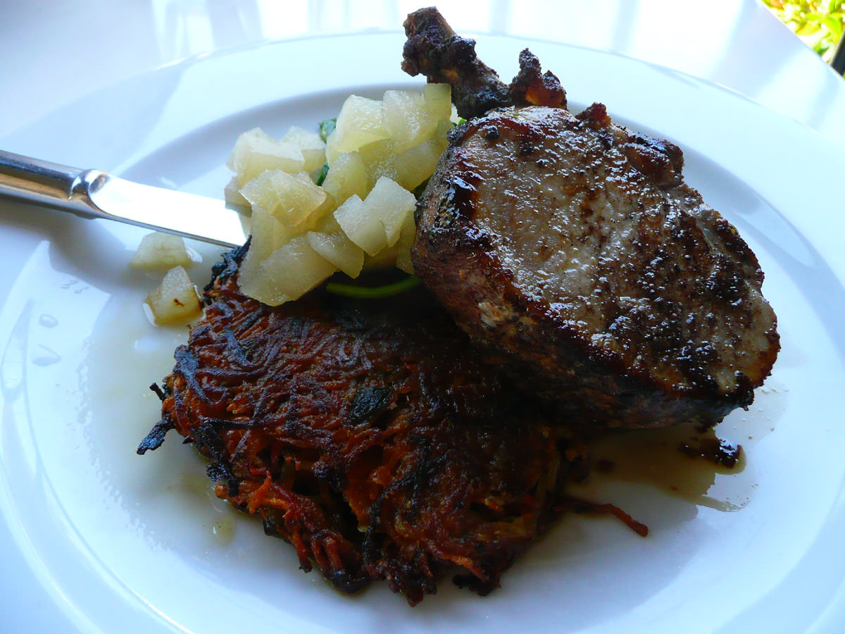 Pork rib eye with sweet potato rosti, spinach and mead-spiced apples