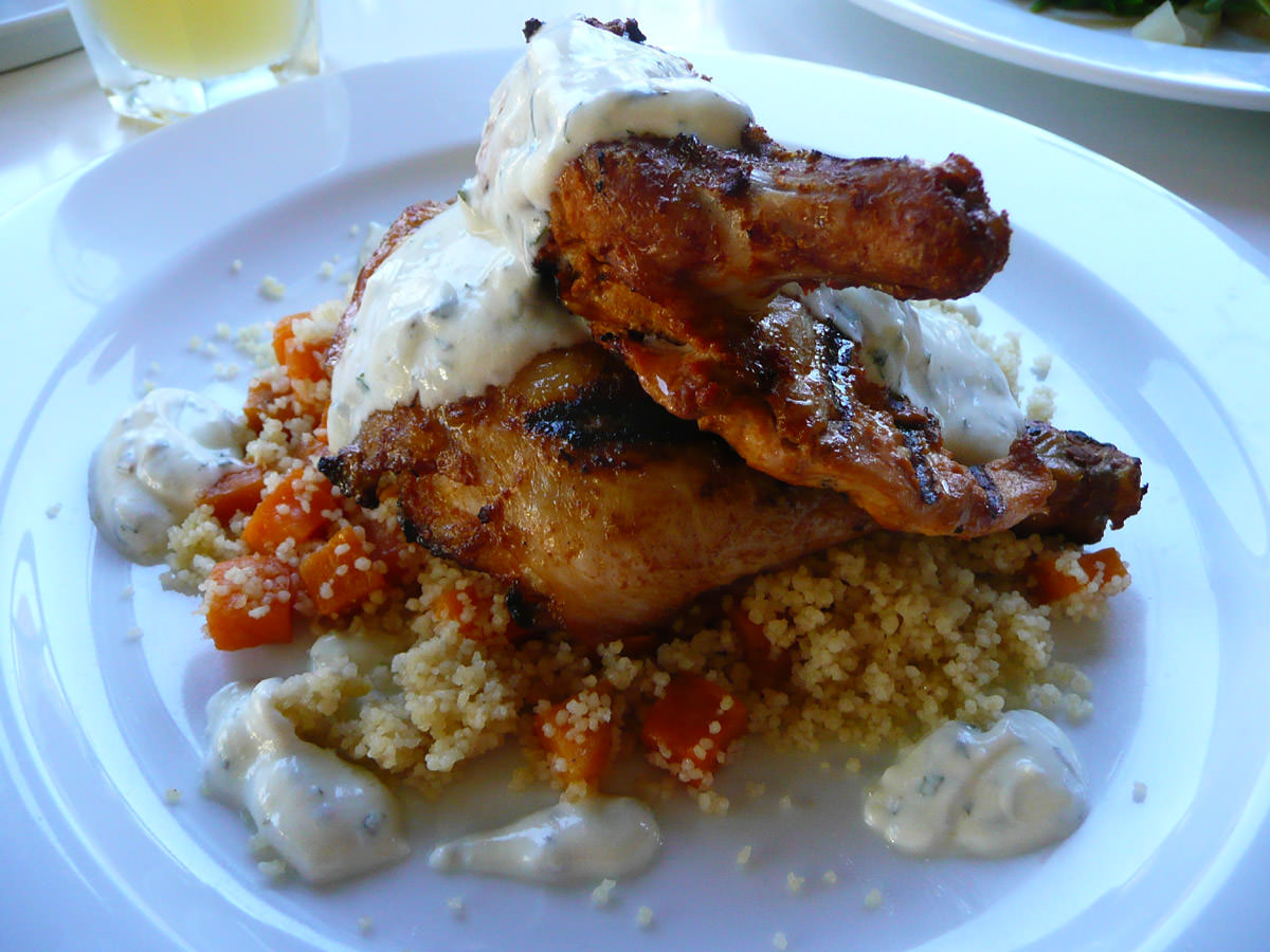 Peri peri spiced chicken with orange scented cous cous, roasted sweet potato and yoghurt dressing 
