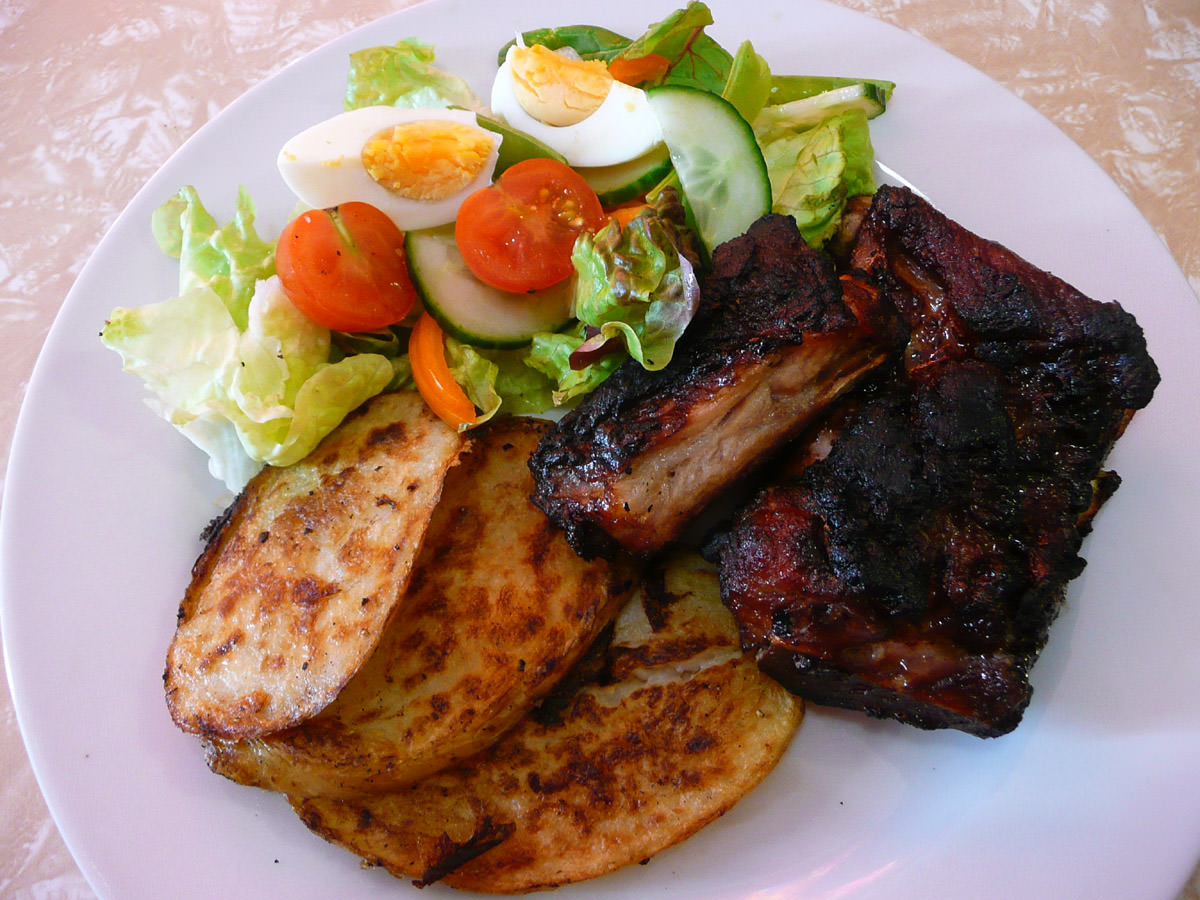 My plate: BBQ pork ribs, BBQ potatoes and salad