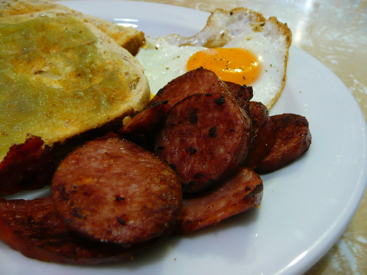 Fried bratwurst sausage, kaya on toast, fried egg