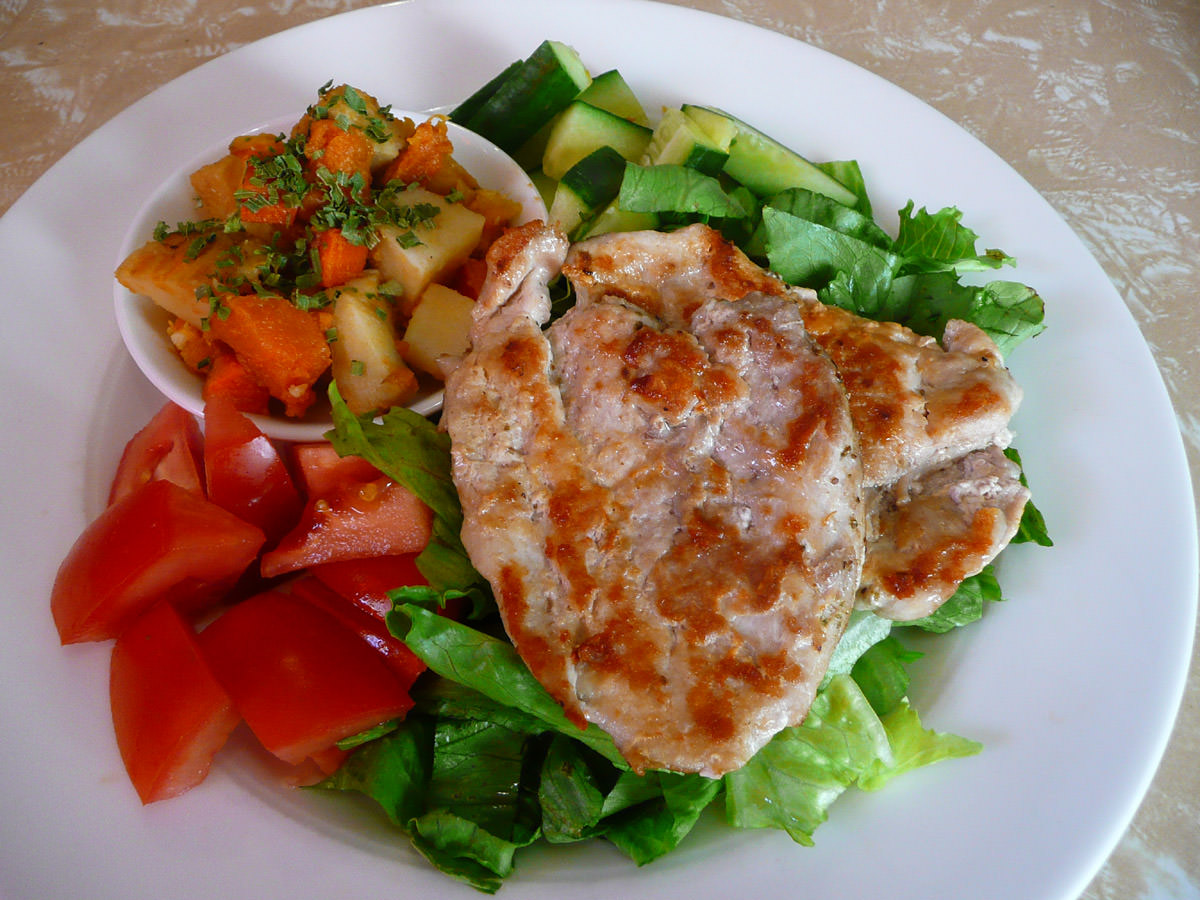 Celery salt chicken escalopes with salad and roasted vegetables