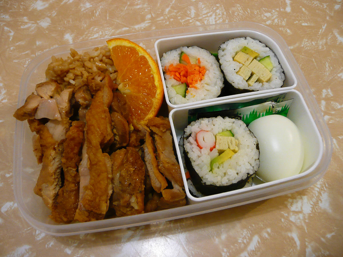 Bento: teriyaki chicken, sushi and hard-boiled egg