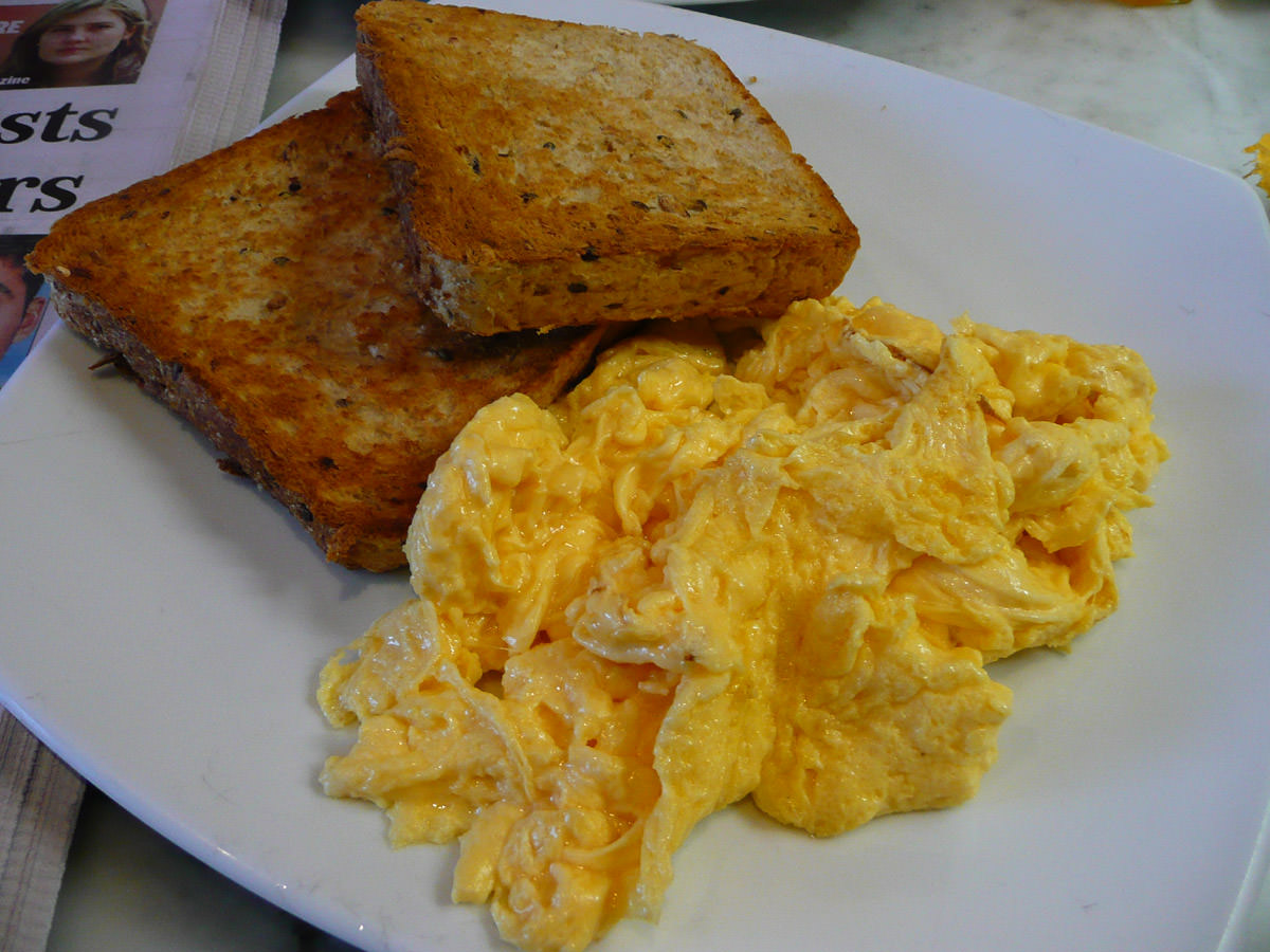 Scrambled eggs on multigrain toast