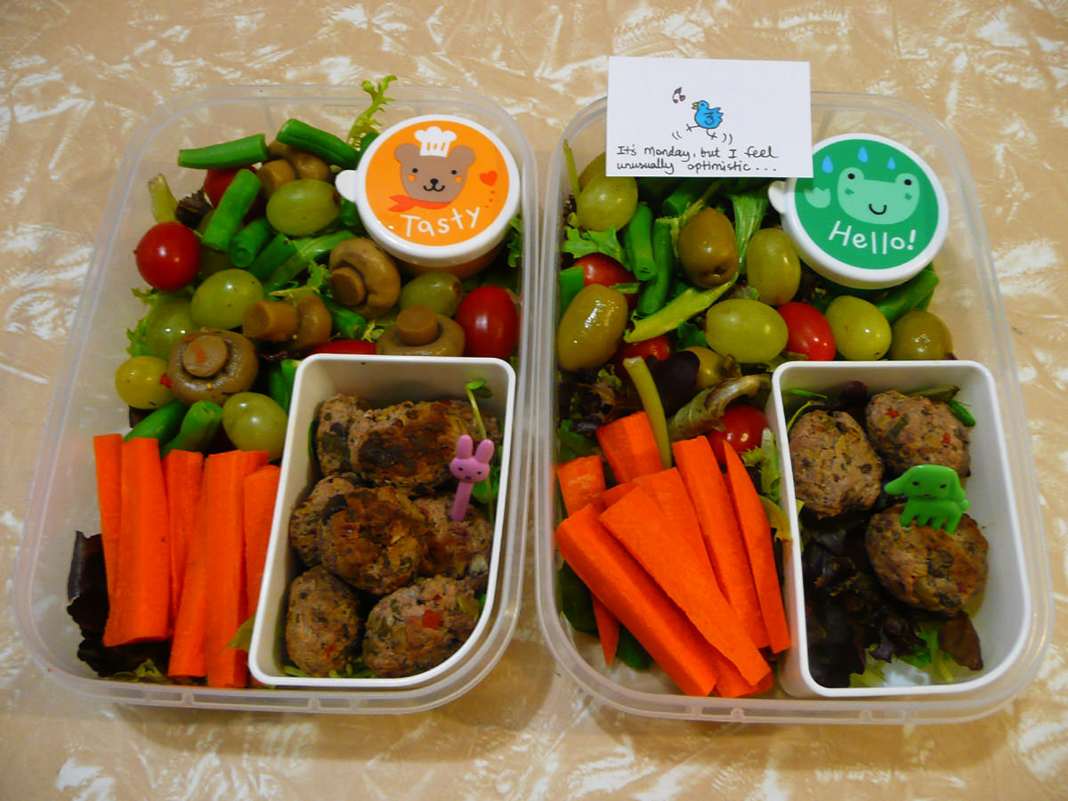 Hers and hers bento lunches with lamb meatballs with salad