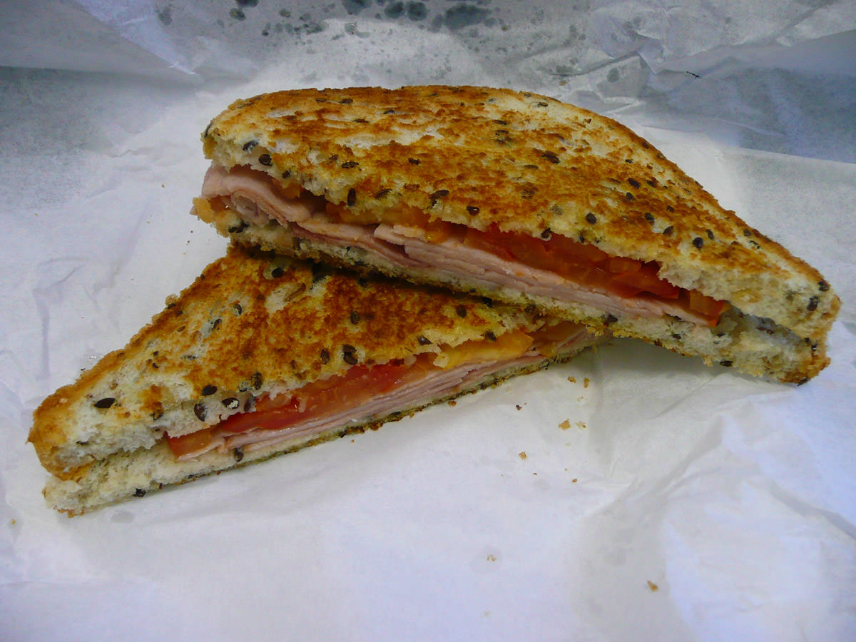 Toasted ham and tomato sandwich on multigrain