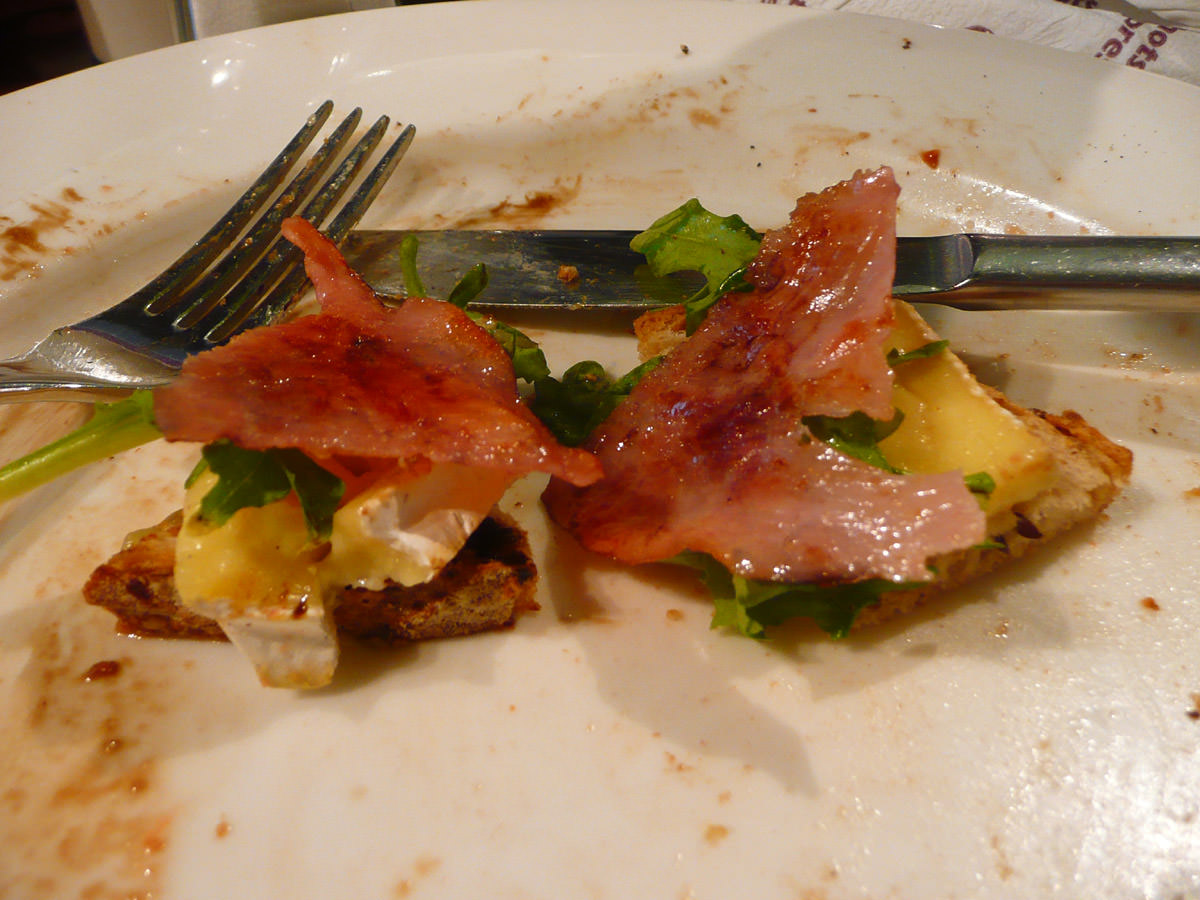 Two mouthfuls left - toast, brie, rocket and ham