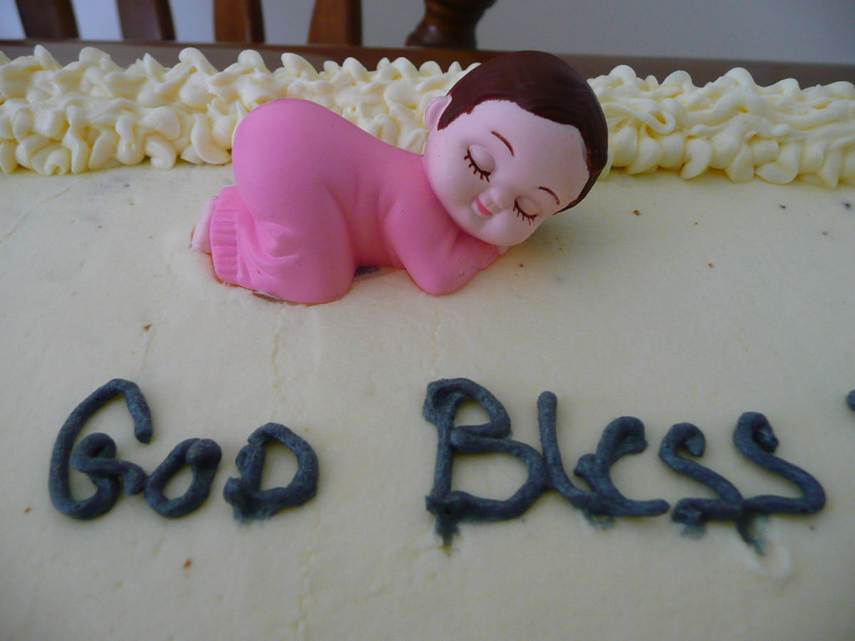 Close-up of baby figurine on Zoe's cake