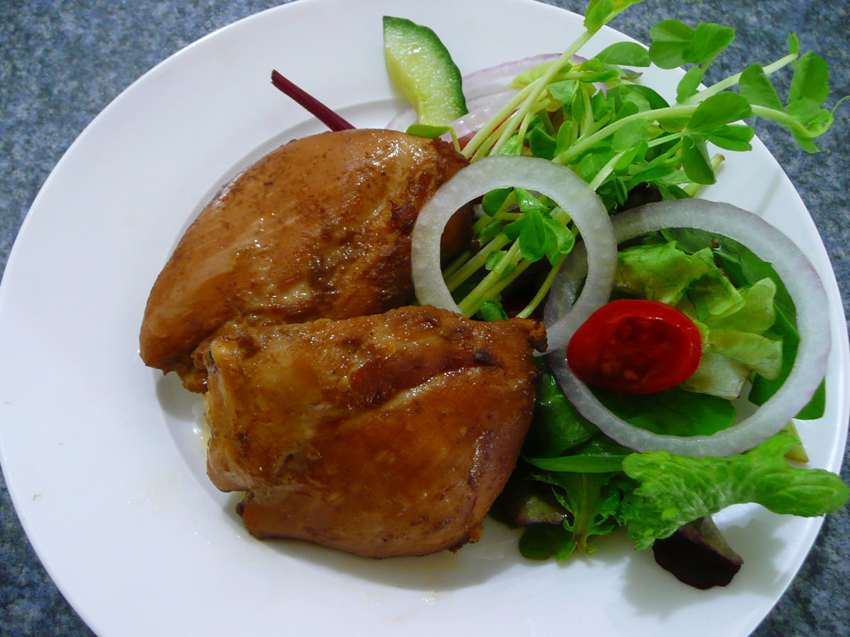 Marinated chicken thighs with salad