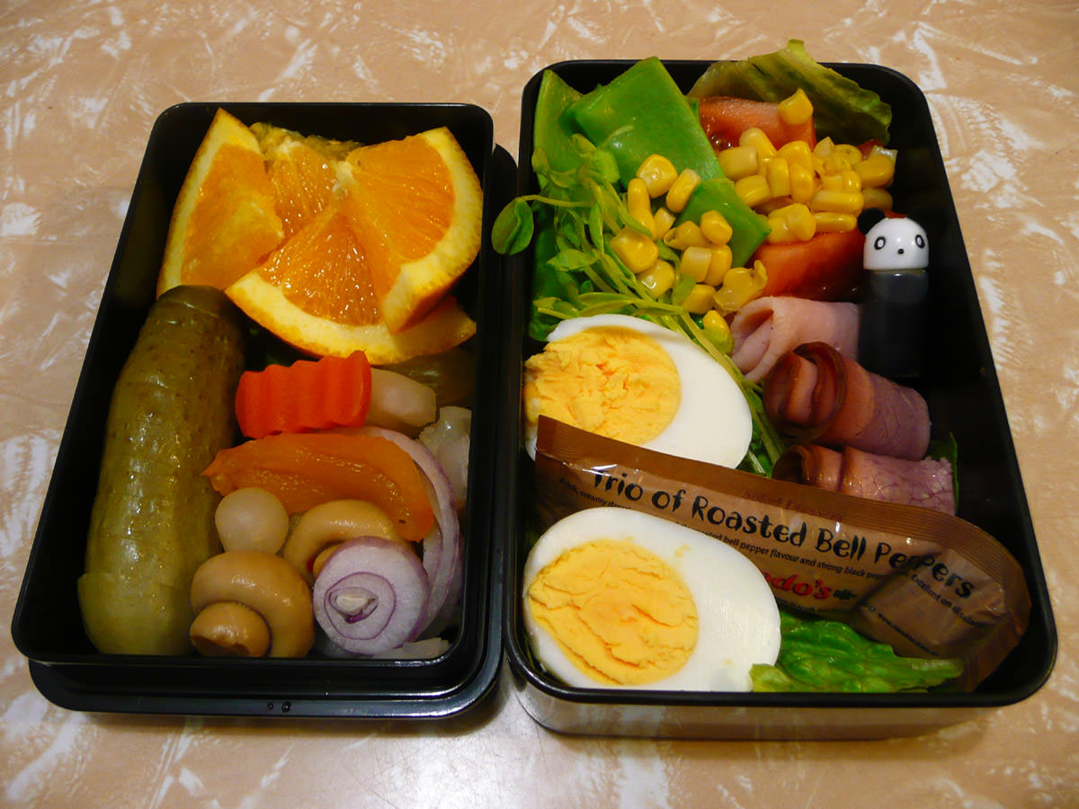 Jac's bento - hard-boiled egg, cold meats, pickles, salad and fruit