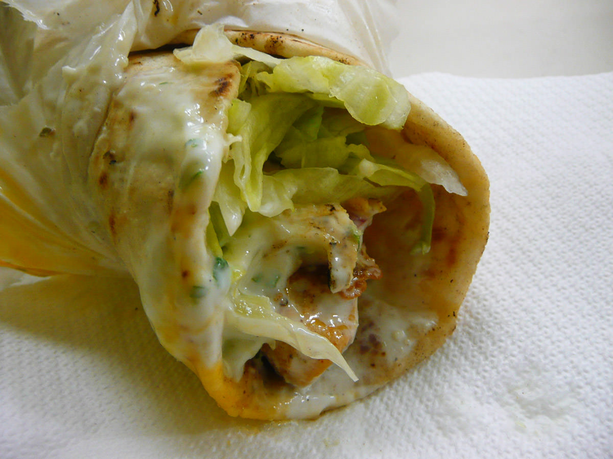 Chicken kebab with runny egg and garlic sauce