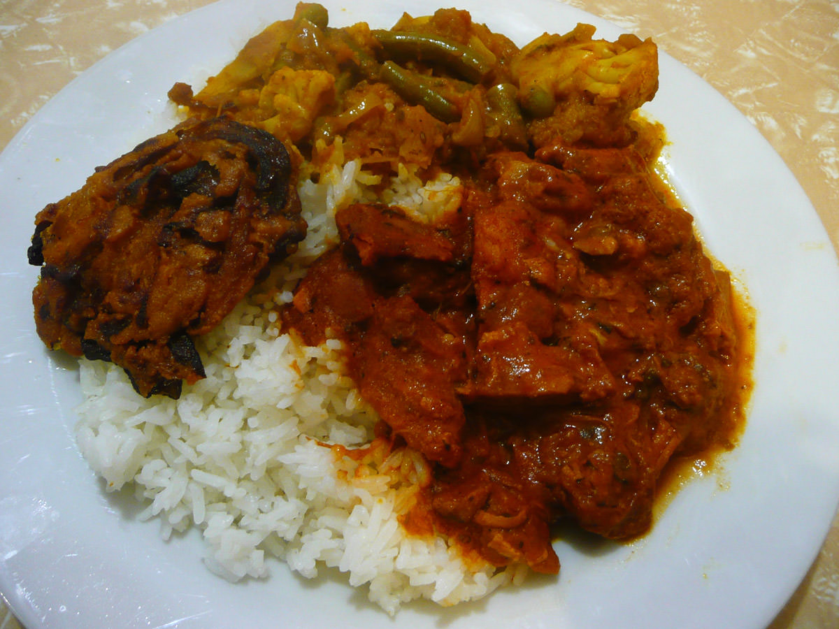 Onion bhaji, vegetable and potato curries, butter chicken and rice