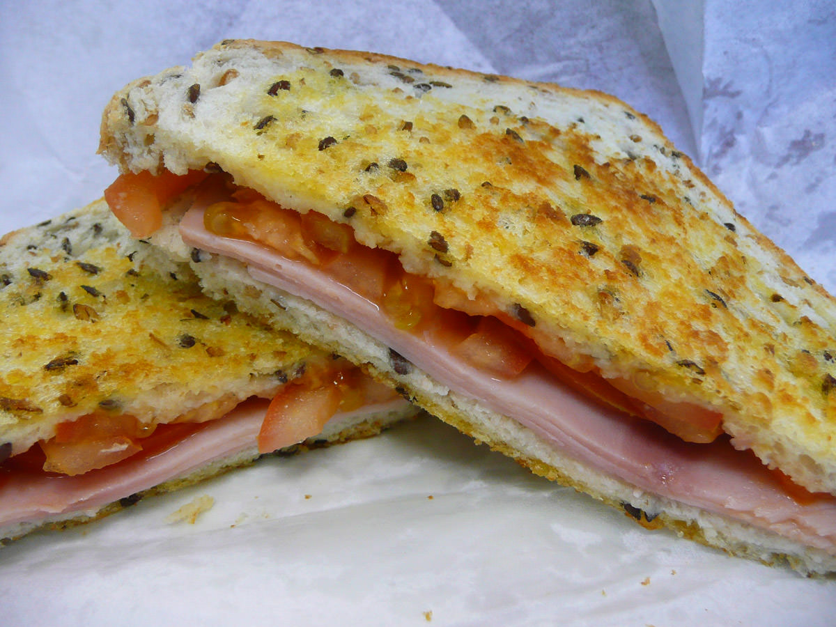 Toasted ham and tomato sandwich on multigrain
