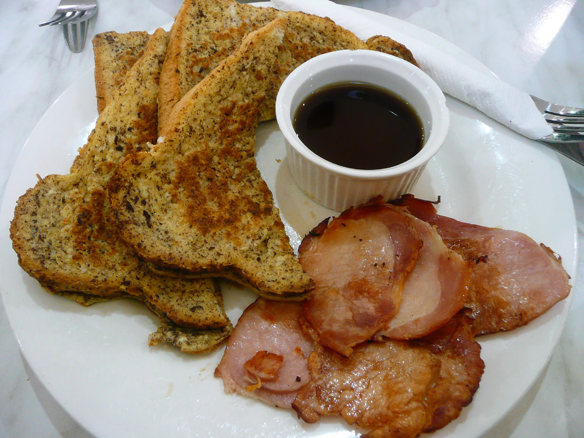 French toast with maple syrup and a side of bacon