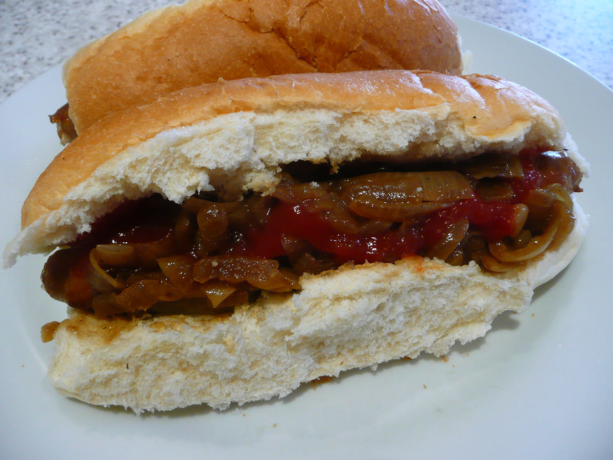 Sausage, onions and tomato sauce in a bun