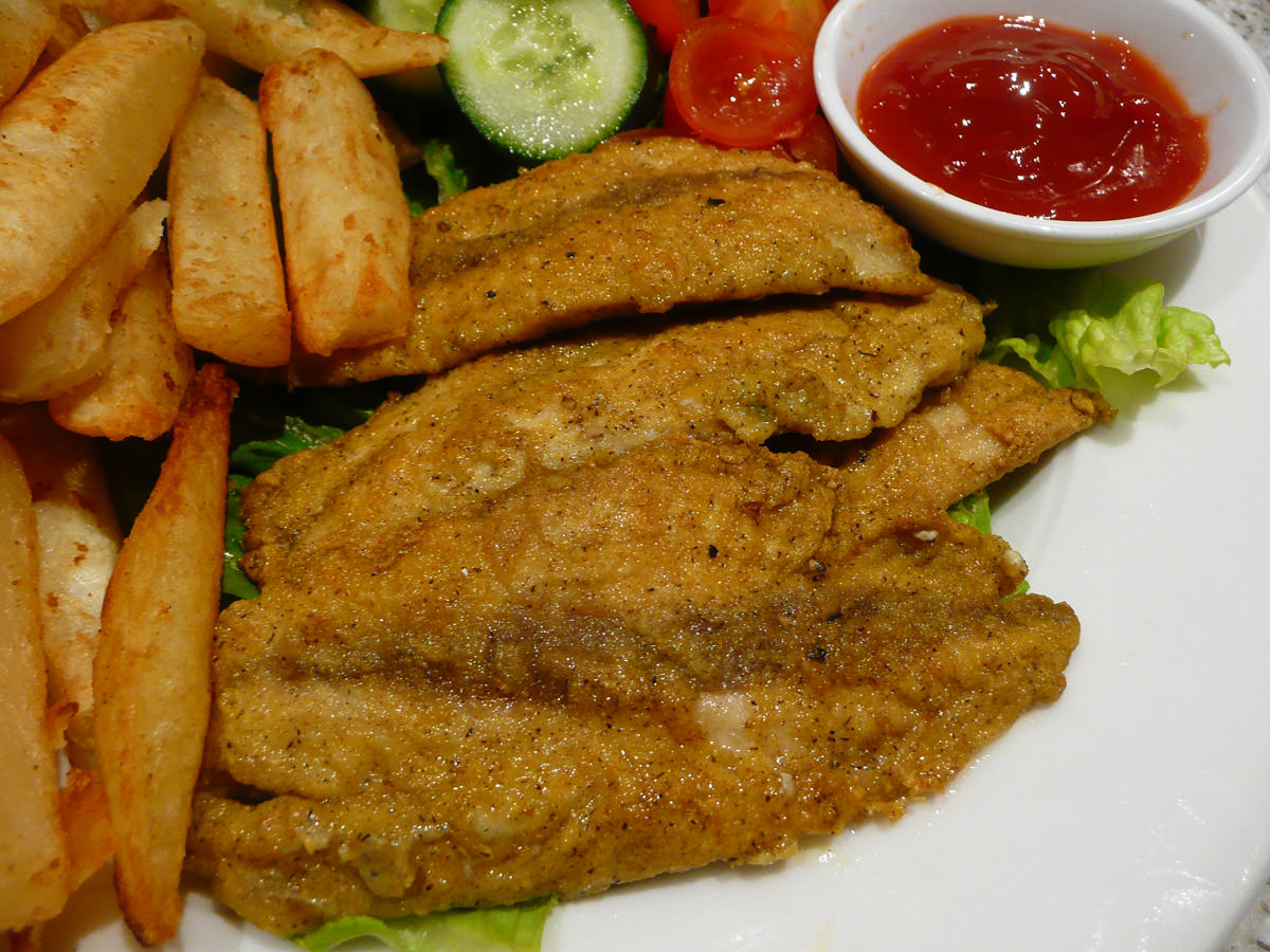 Curried fried herring fillets - close-up