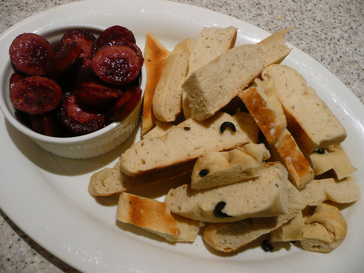 Fried sausage and toasted olive bread