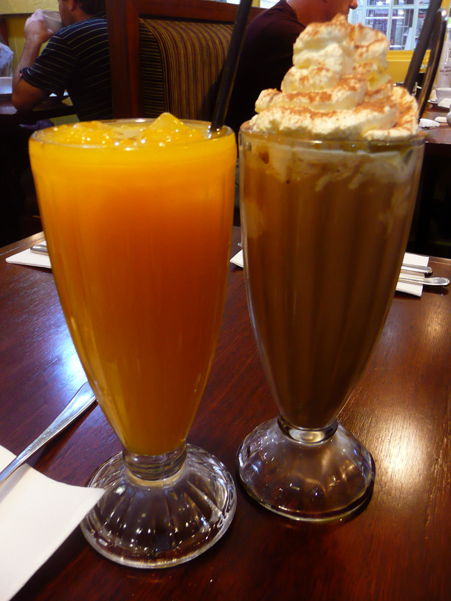 Orange juice and iced coffee with cream and ice cream