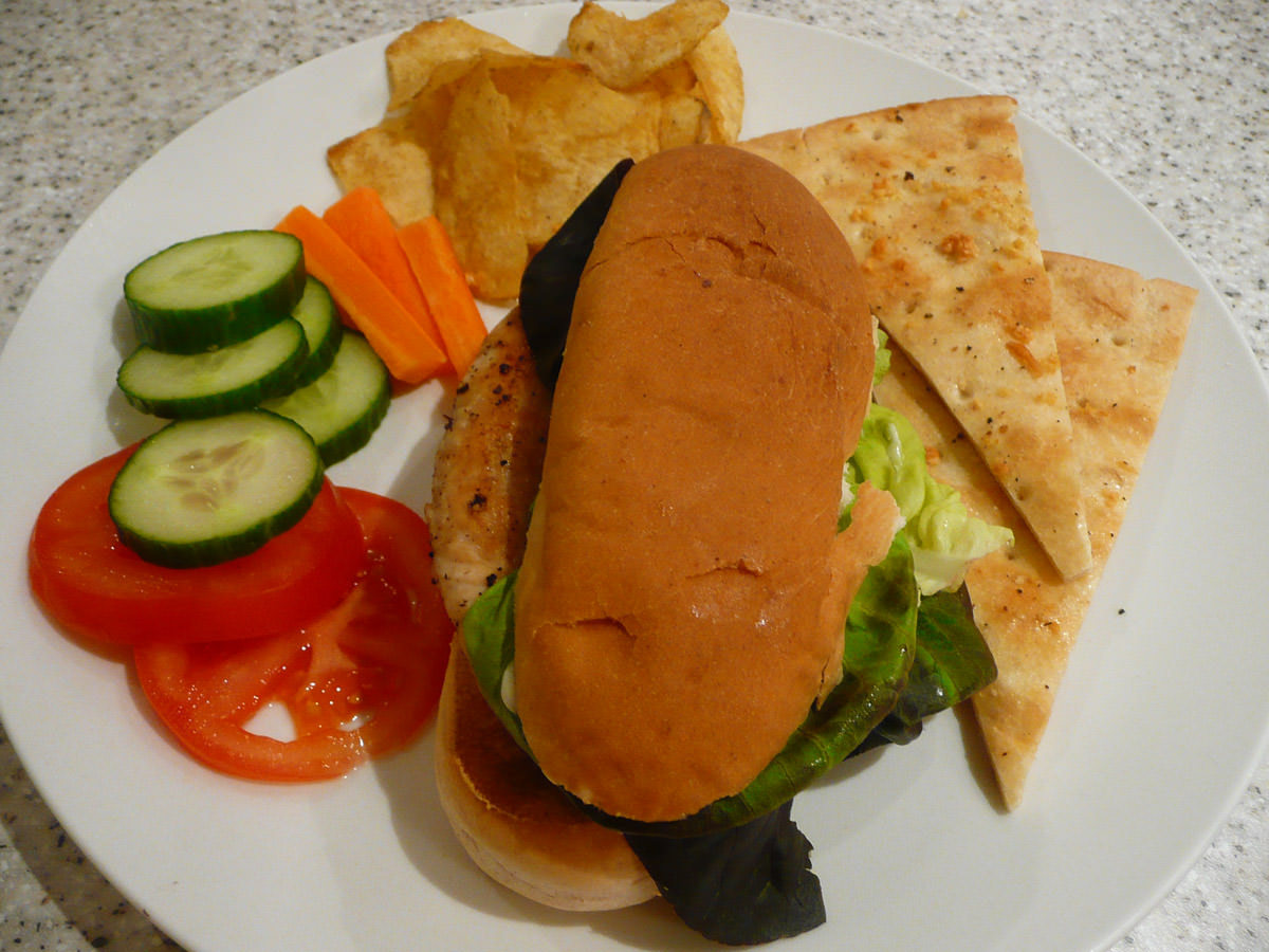 Turkey breast sandwich, salad, crisps and garlic pizza
