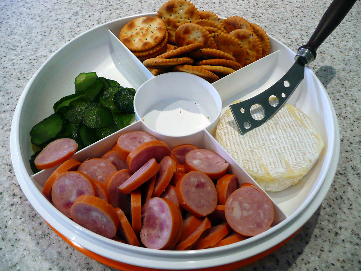 Sausage, sweet pickles, crackers and cheese