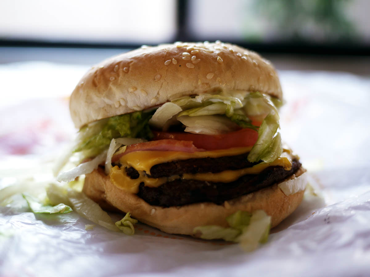 Bacon double cheeseburger deluxe with heavy lettuce and onion