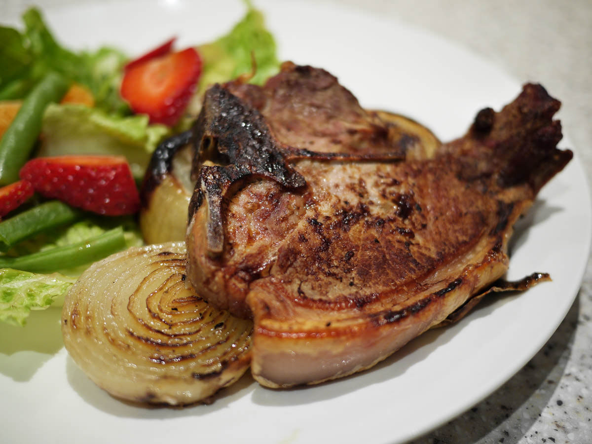 Grilled pork chop and onions