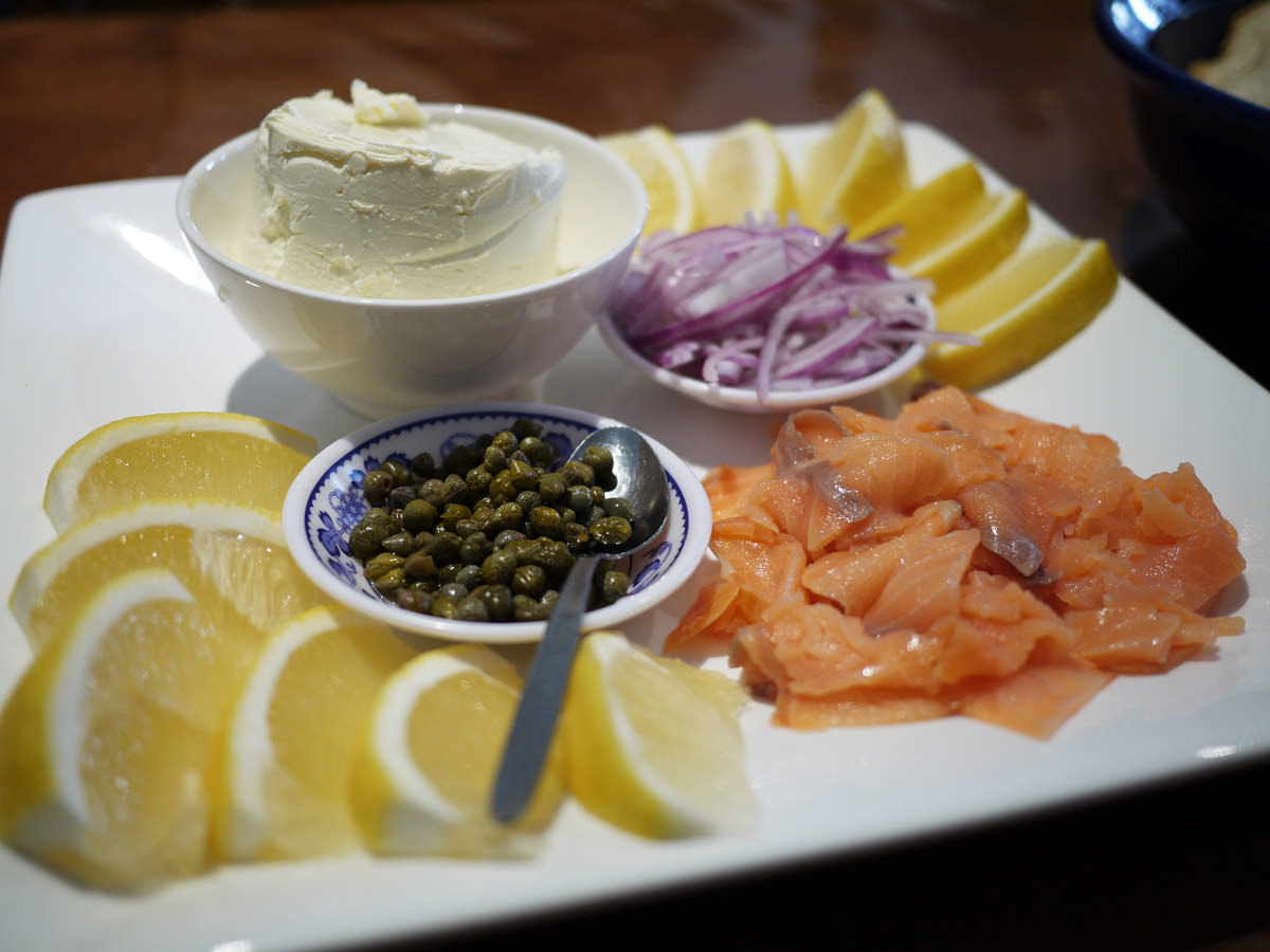 Platter of smoked salmon, cream cheese, red onion, capers and lemon