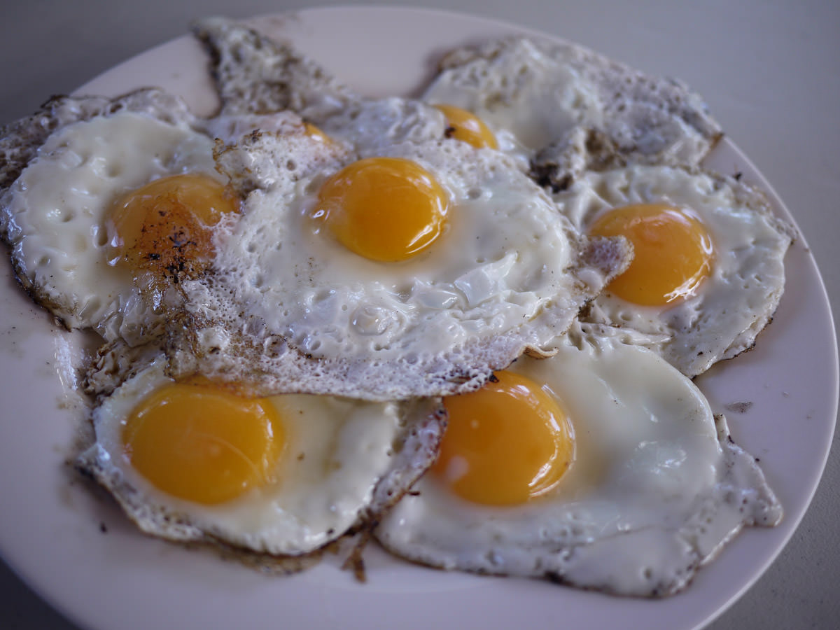 Fried eggs cooked on the barbecue