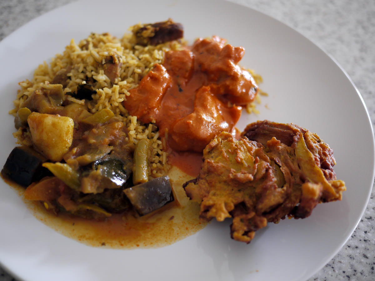 Butter chicken, vegetable curry, biryani and onion bhaji from Maya Masala