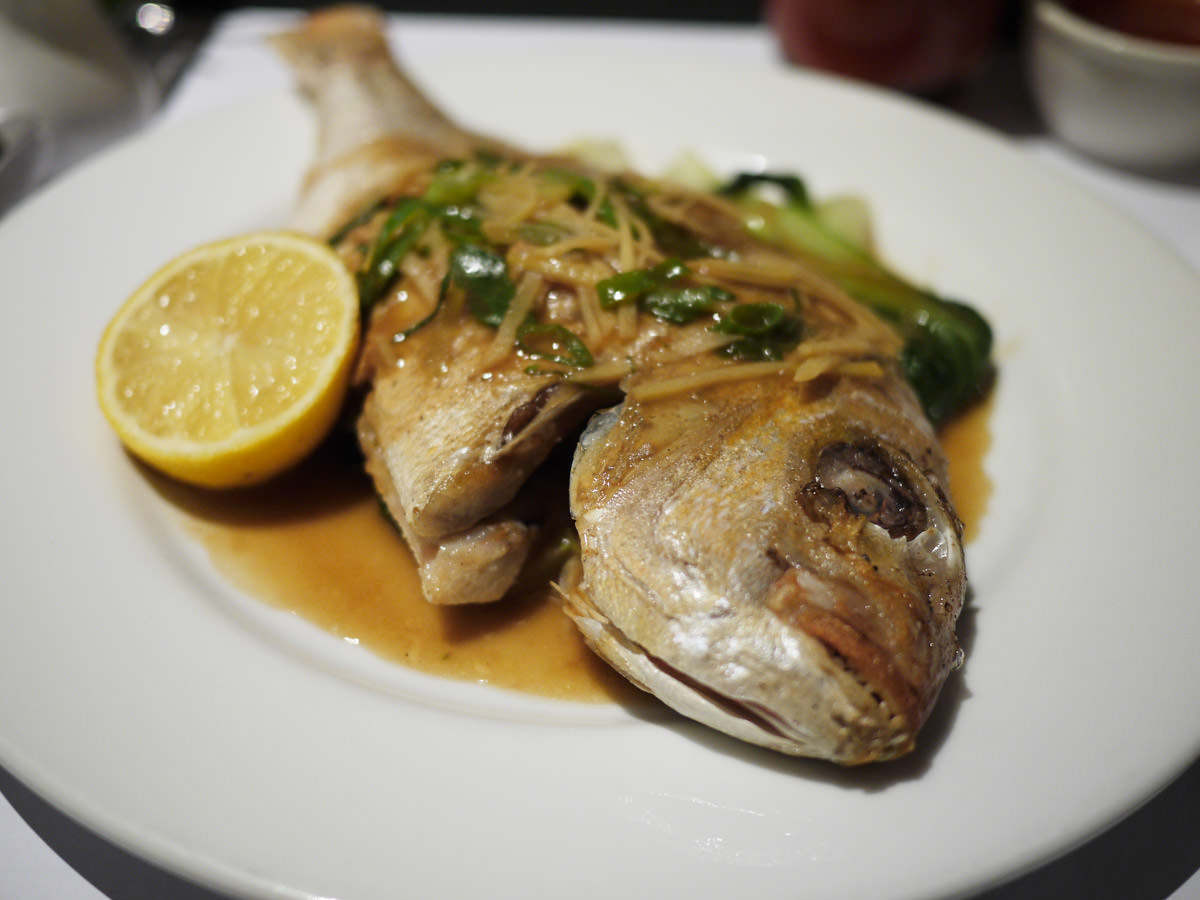 Baked whole baby snapper with ginger, green onion and soy, served with rice