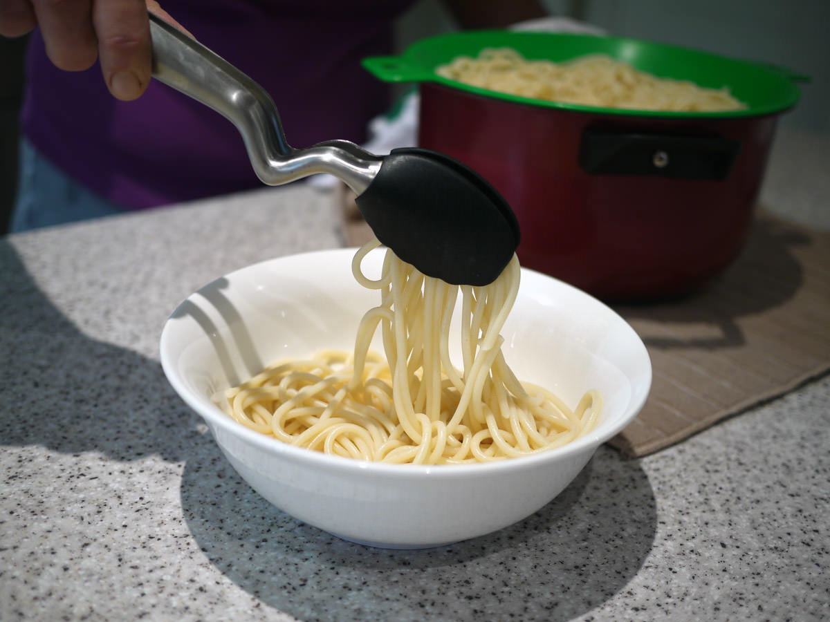 Serving up the spaghetti using the clongs